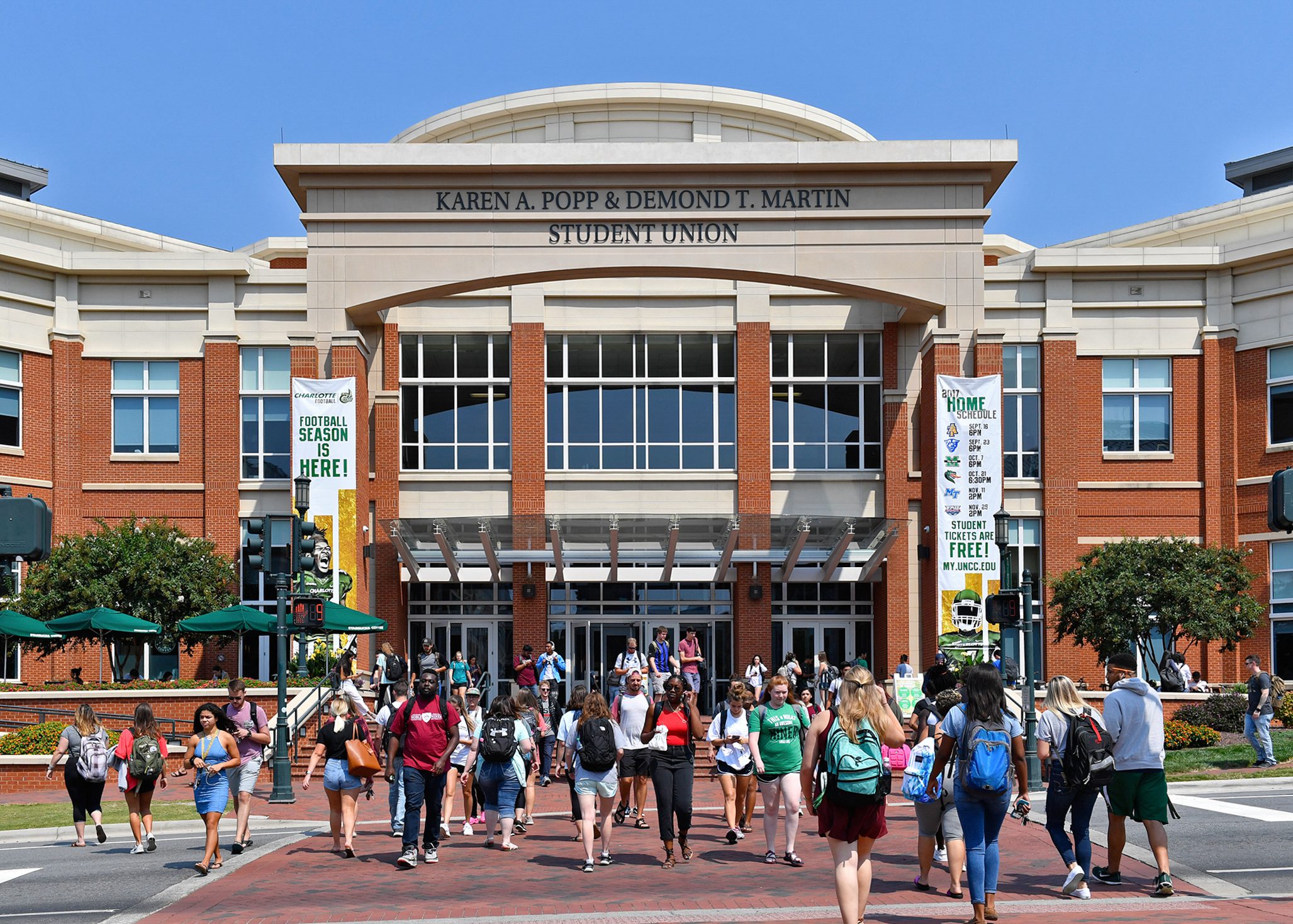 Students walking in front of the Karen A. Popp & Demond T. Martin Student Union.
