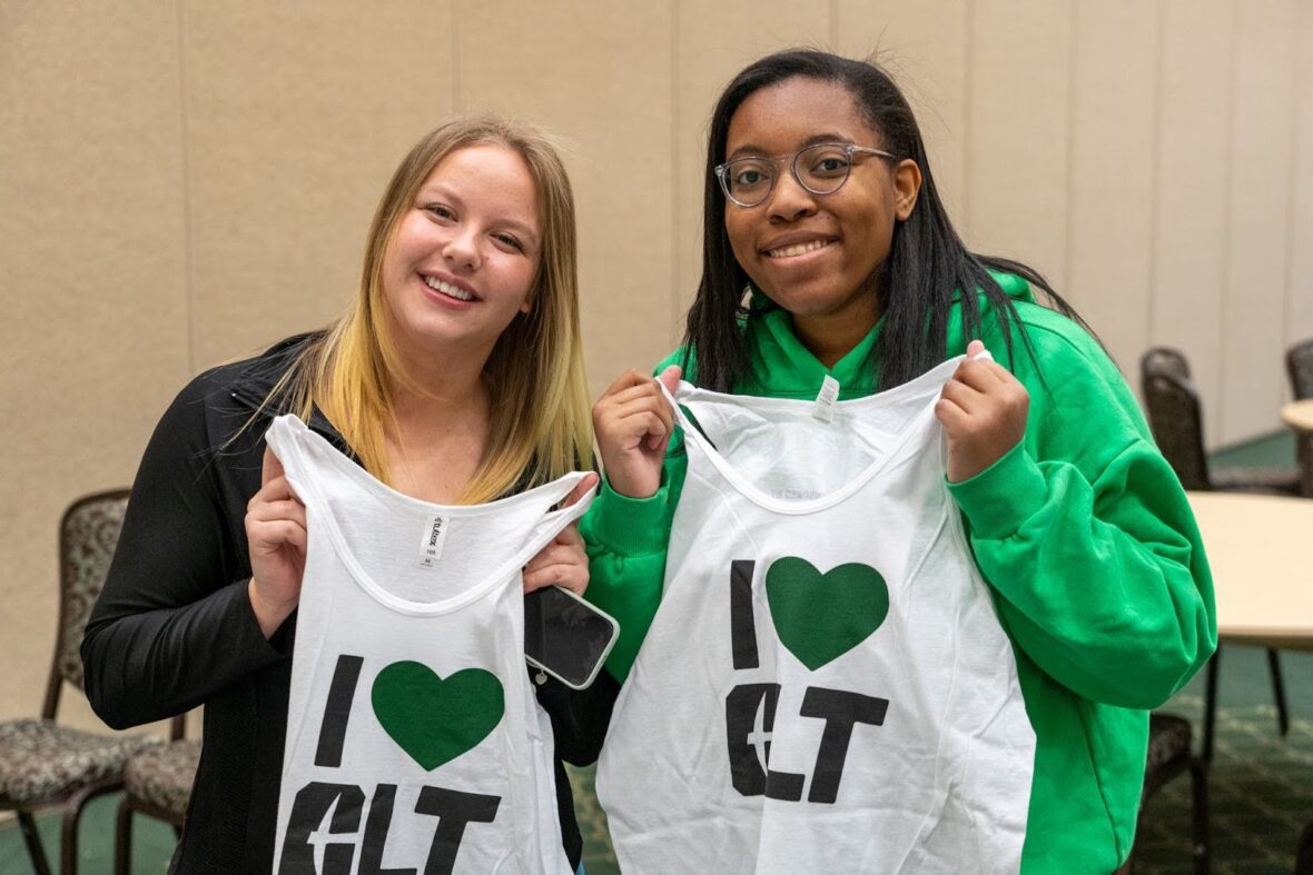 two volunteers posing for a photo