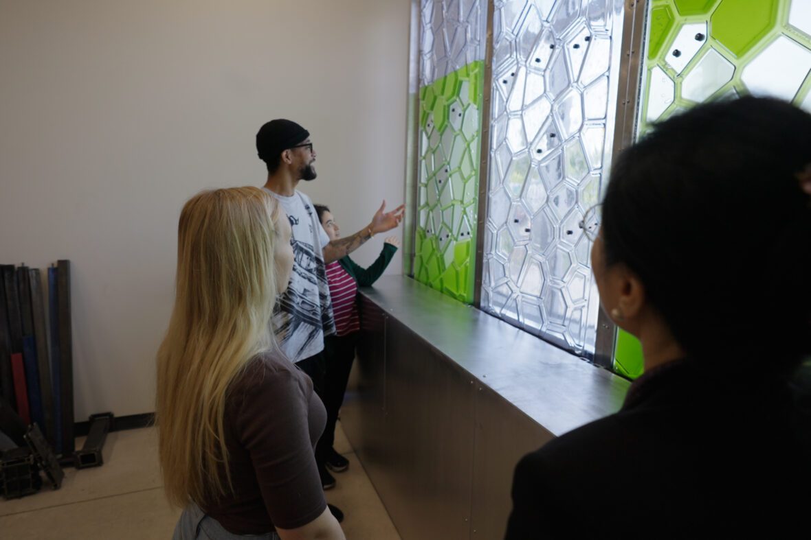 Three UNC Charlotte College of Arts and Architecture students at the innovation barn